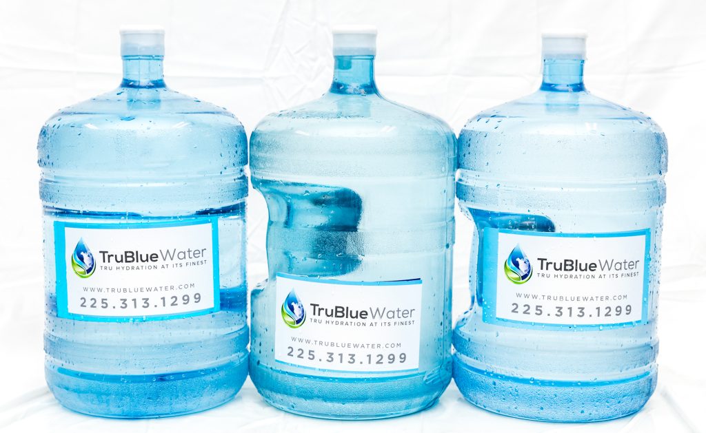 Three TruBlue Water 5 gallon and 3 gallon bottles